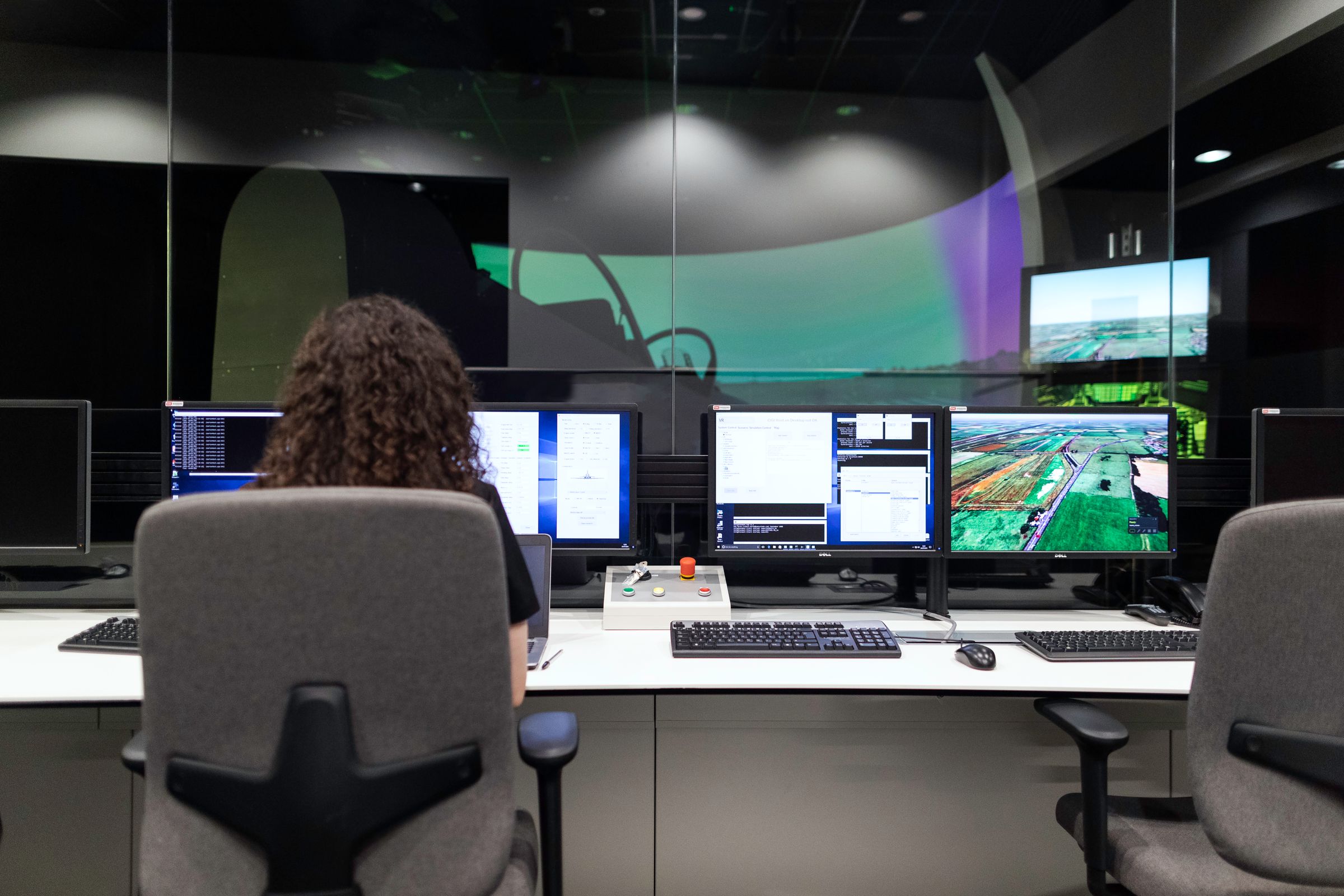 Security operations centre with a wall of monitoring screens