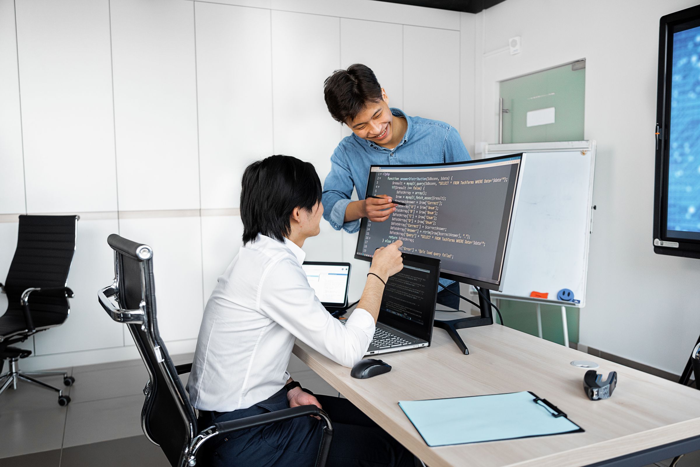 Two developers reviewing code together